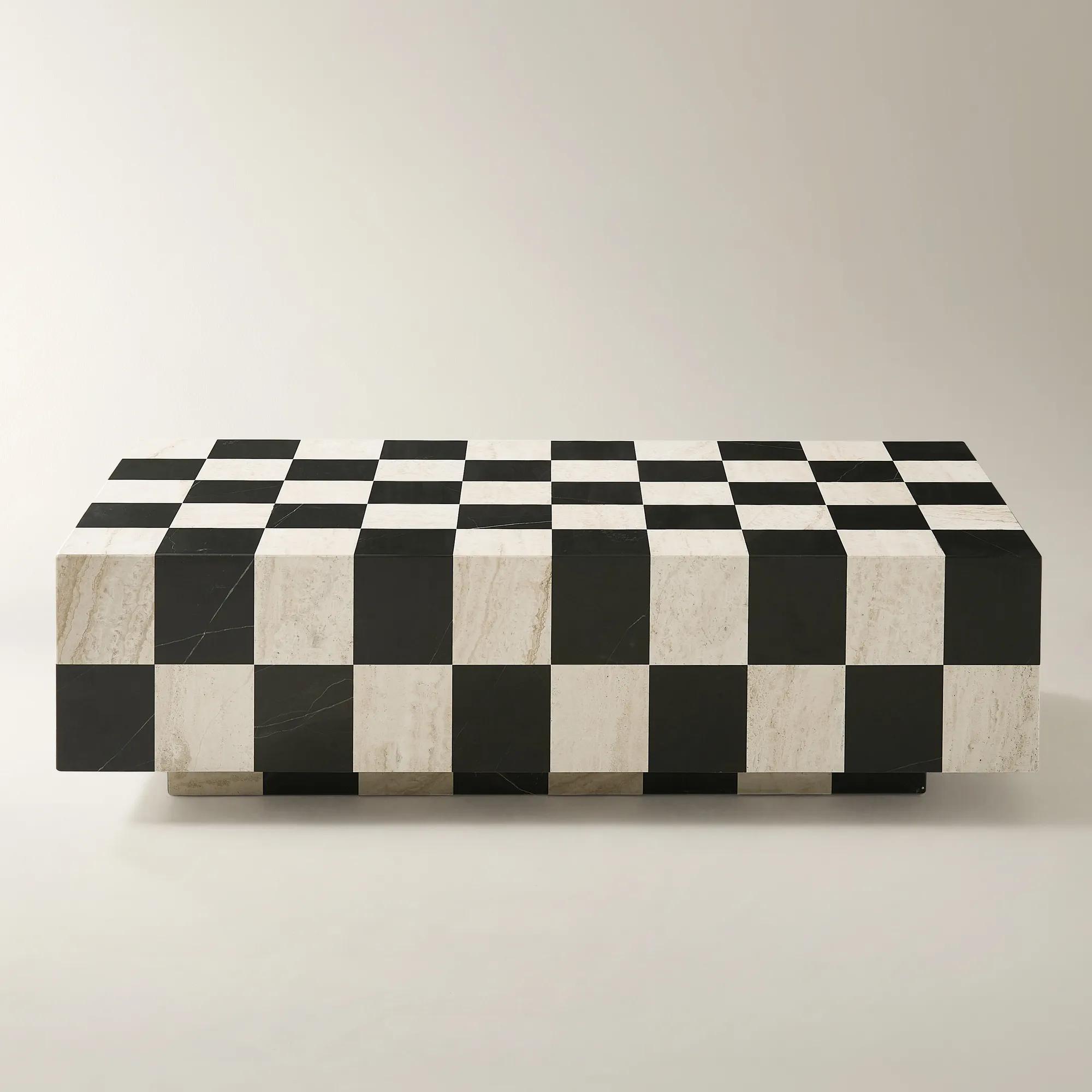 Low rectangular Chessa coffee table with a black marble and pale travertine checkerboard surface and recessed base.
